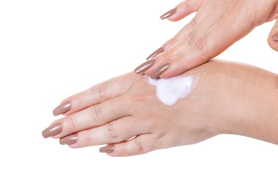 female hands in cosmetic cream on white isolated background