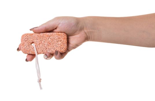 pumice stone in female hand on white isolated background