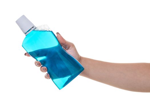 bottle with rinse aid for mouth in hand on white isolated background