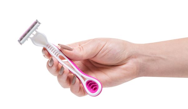 razor in a female hand on white isolated background