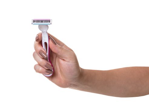 disposable razor in a female hand on white isolated background