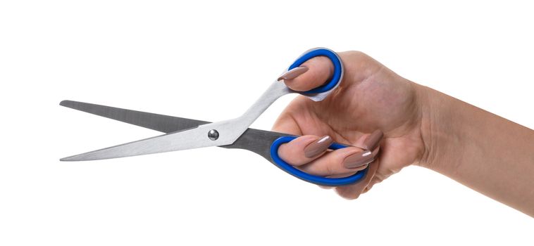 scissors in a female hand on white isolated background