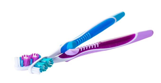 new toothbrushes close-up on white isolated background