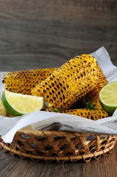 Delicious fried corn, grated with lime  and seasoned with spicy spices. Indian and Mexican style. 
