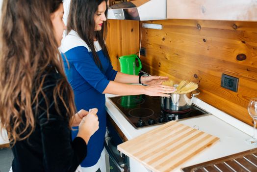 Mother and Her Lovely Daughter Cooking Some Spaghetti’s in the Kitchen for Dinner