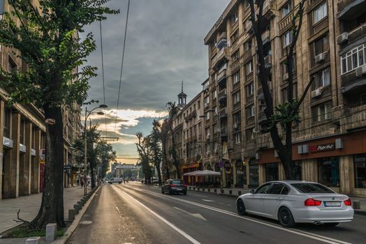 BUCHAREST, ROMANIA - 07.20.2018. Old Center of Bucharest, Romania in a cloudy summer morning. Sullen and unpleasant atmosphere, dirty streets and shabby buildings.