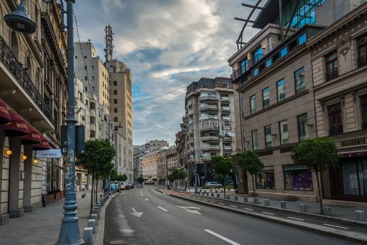 BUCHAREST, ROMANIA - 07.20.2018. Old Center of Bucharest, Romania in a cloudy summer morning. Sullen and unpleasant atmosphere, dirty streets and shabby buildings.