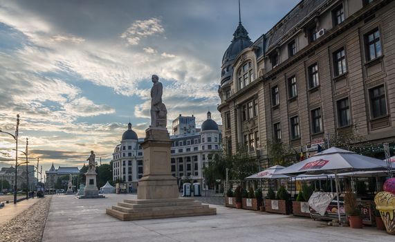 BUCHAREST, ROMANIA - 07.20.2018. Old Center of Bucharest, Romania in a cloudy summer morning. Sullen and unpleasant atmosphere, dirty streets and shabby buildings.