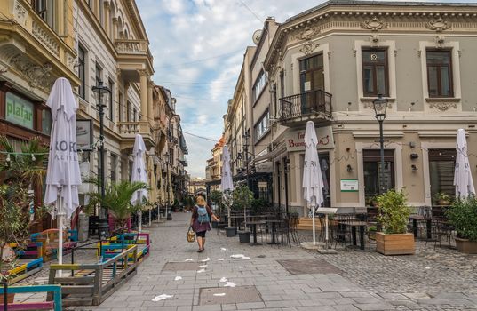 BUCHAREST, ROMANIA - 07.20.2018. Old Center of Bucharest, Romania in a cloudy summer morning. Sullen and unpleasant atmosphere, dirty streets and shabby buildings.