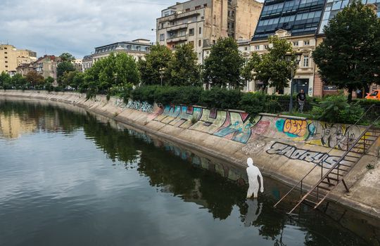 BUCHAREST, ROMANIA - 07.20.2018. Old Center of Bucharest, Romania in a cloudy summer morning. Sullen and unpleasant atmosphere, dirty streets and shabby buildings.