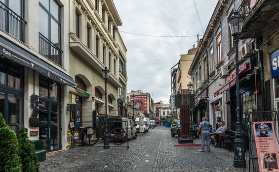 BUCHAREST, ROMANIA - 07.20.2018. Old Center of Bucharest, Romania in a cloudy summer morning. Sullen and unpleasant atmosphere, dirty streets and shabby buildings.