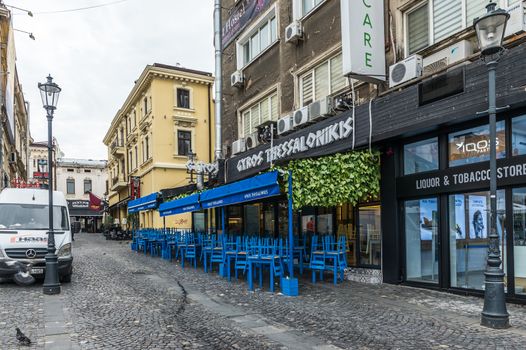 BUCHAREST, ROMANIA - 07.20.2018. Old Center of Bucharest, Romania in a cloudy summer morning. Sullen and unpleasant atmosphere, dirty streets and shabby buildings.