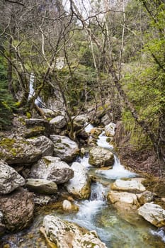 Small river on the path of Mavri Spilia (literally Black Cave), close to Proussos village, Greece