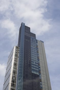 london city centre skyscraper against a blue cloudy sky