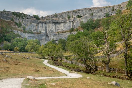 View of the curved cliff at Malham Cove in the Yorkshire Dales National Park