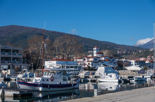 Platamonas, Greece - January 2, 2018: Harbor with boats and fishing schooners. Platamonas (Greek) is a sea-side resort and fishermans village in south Pireia, Central Macedonia.