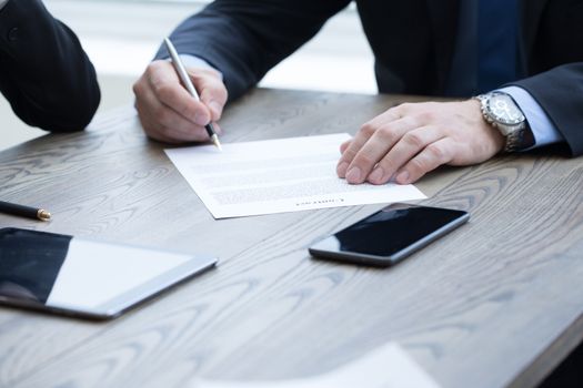 Business man sign contract on the desk at meeting