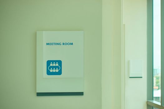 The meeting room white sign on the wall with copy space.
