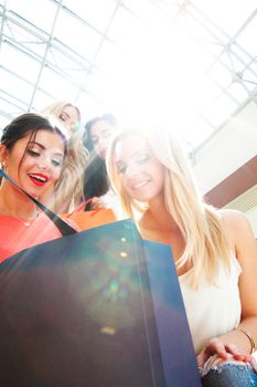 beautiful young women shopping at mall