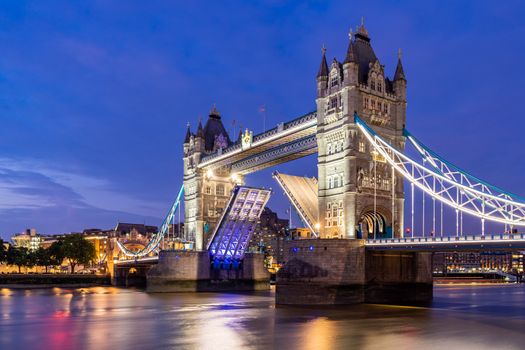 London Tower Bridge lifting up at Sunset dusk, London UK.