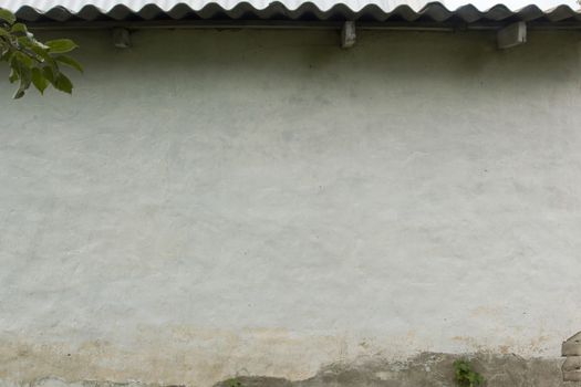 Wall of the rural house covered with plaster