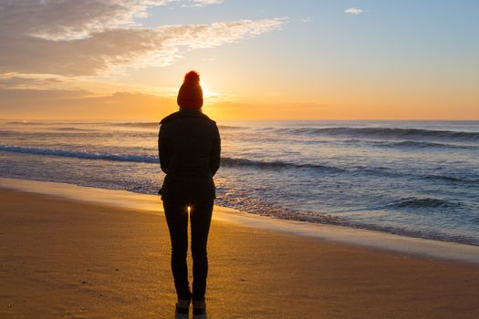 Watching the sunrise on a winters morning down at the beach, the golden sands glistening in the early morning sunshine