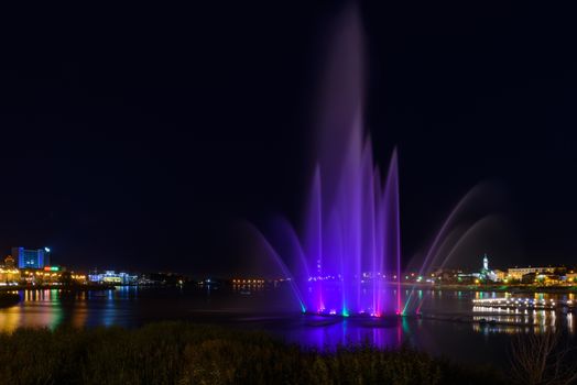 High fountain in Kazan city during a beautiful summer night. waterfront of Kaban Lake.