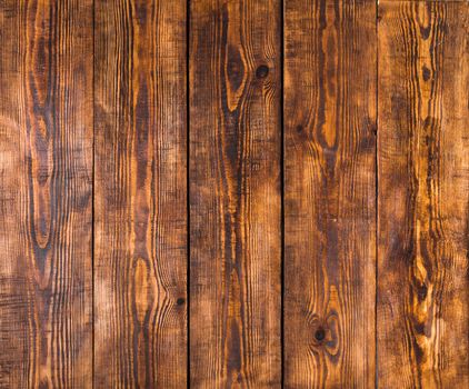 Old wooden panels with cracks, scratches, swirls, notch and chips. Background with space for text