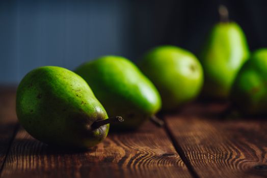 Green Pears on a Wooden Table. Copy Space