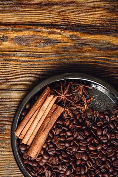 Coffe Beans with Spices on Plate. View from Above.