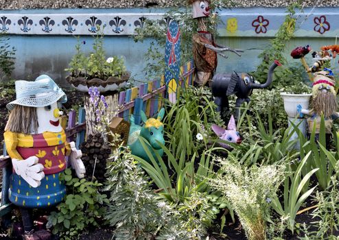 cheerful front garden with figures of fabulous animals near an apartment building