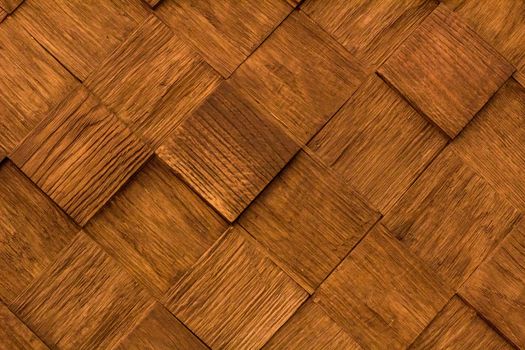 Natural wooden diagonal background pattern of golden brown quadrate pieces