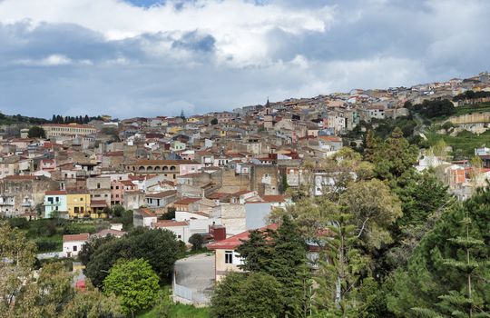 skyline with old houses of the village Sennori seen from the upper promenade on  Sardinia, Italiy