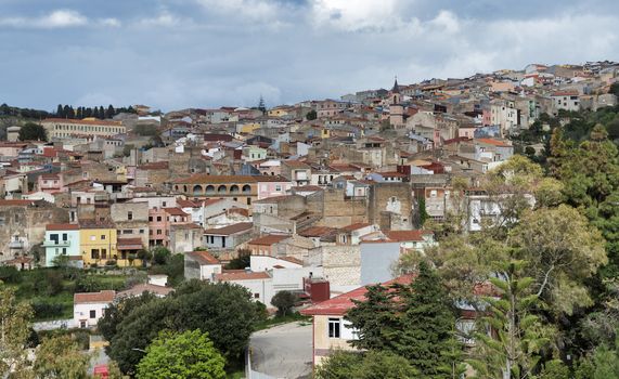 skyline with old houses of the village Sennori seen from the upper promenade on  Sardinia, Italiy