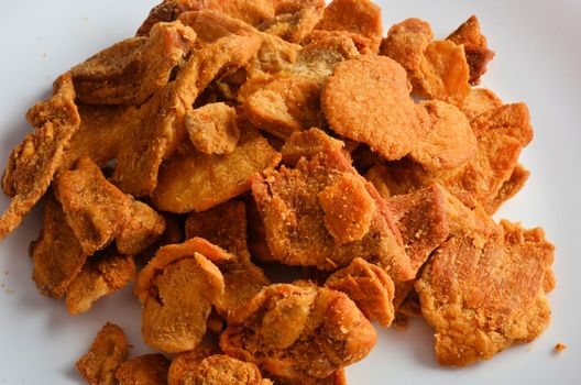 Pork rind favorite food in piedmonte italy, isolated on white in restaurant.