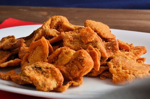 Pork rind favorite food in piedmonte italy, isolated on white in restaurant.