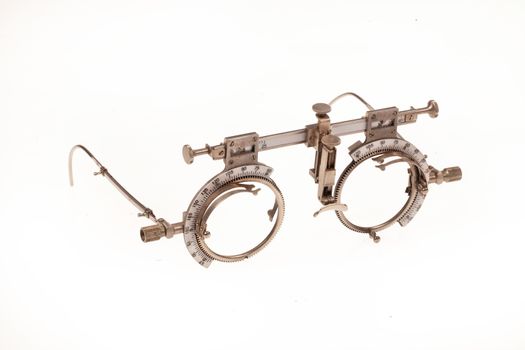 Old optometric device to choose the correct lense on isolated background