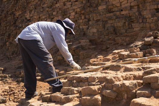 SRITHEPH,THAILAND JUNE 09, 2017 - Workers are renovating the ancient city by breaking old brick out to make the city look more beautiful.