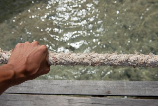 Rope handles that guide and hold water.