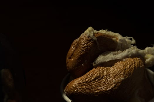 Close up Durian seeds after eating meat. Black background makes the seeds stand out.