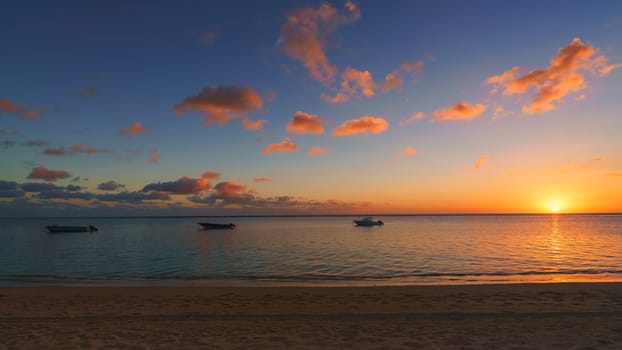 Amazing sunset at Mauritius panorama,Fishing boat at sunset time.