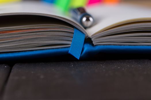 Planning your day, A day blank day planner with a blue pen