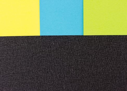 background of colored stickers on the black