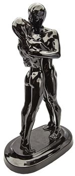 Black glossy ceramic statue of a nude couple kissing