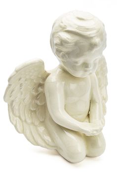 small figurine of white angel, kneeling with open wing