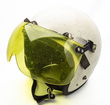 Old white bike helmet with yellow visor