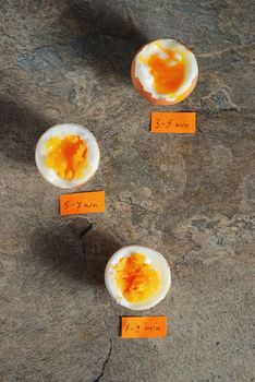 Boiled eggs by the minute on stone table