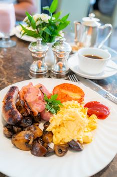 Full English Breakfast on Table with coffee