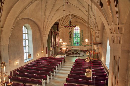 Inside Church with Rows of Benches.