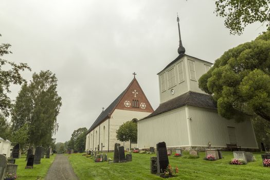 Church at Backen, Umea, Sweden with a cloudy sky.